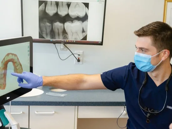 Dentist reviewing a dental scan with a patient