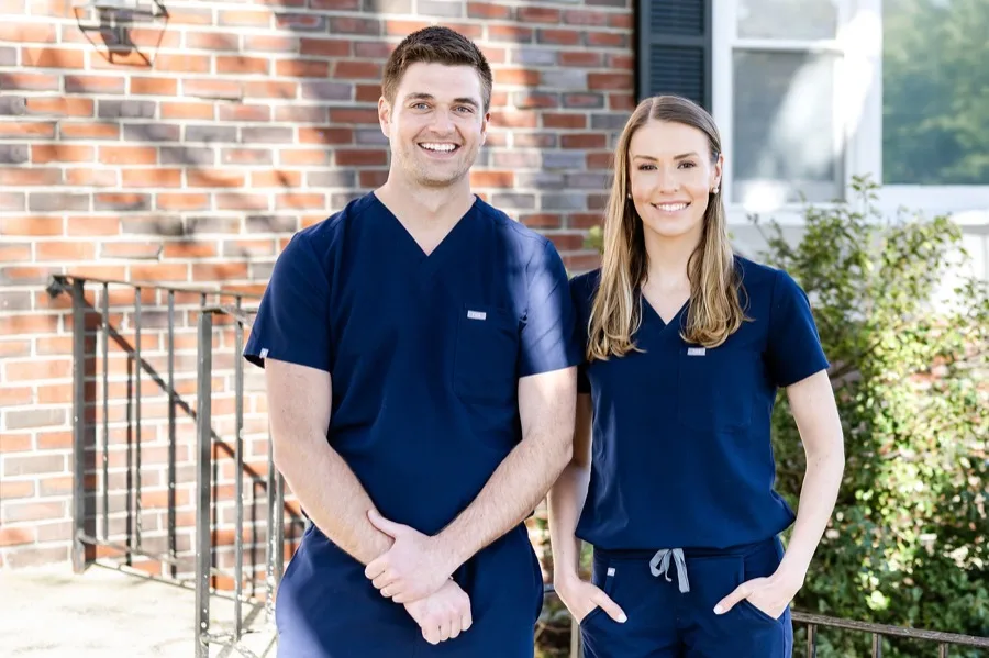 Dr. Ben Trottier and Dr. Sara Trottier standing outside Cohasset Village Dentistry
